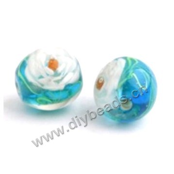 Bead, lampworked glass,blue with flower, 16x16mm round.mini order 50pc 