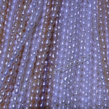Pearl, cultured freshwater,white pink,2-3mm rice, AA grade. Sold per bag of one strand