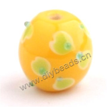 Bead, lampworked glass,yellow with flower, 16x16mm round.mini order 50pc 