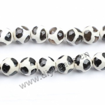 Bead, agate, 12mm faceted round, black with white, football shape. Sold per 15-inch strand.
