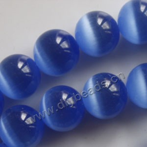 Bead, cat's eye glass,light blue, 12mm round, quality grade. Sold (10) 14.5-inch strands.
