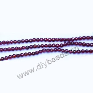 Bead, garnet (natural),rose red, 2mm round, Mohs hardness 7 to 7-1/2. Sold per 14-inch strand
