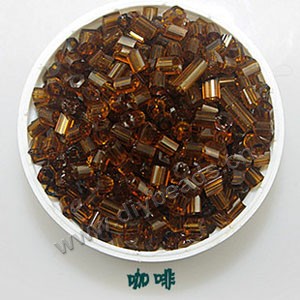 Bugle bead, glass,transparent crystal,coffe ,#1(2x2mm) beads. Sold per pkg of 80 grams,approximately 4,500ps.