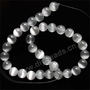 Bead, cat's eye glass,white, 12mm round, quality grade. Sold per 14.5-inch strand.