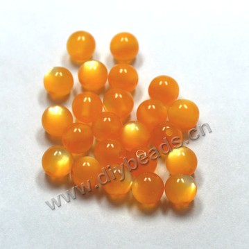 Bead, acrylic, cat's eye  orange, 10mm round. Sold per pkg of 100ps