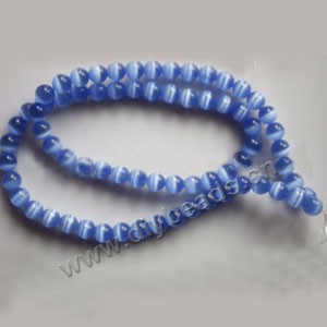 Bead, cat's eye glass,light blue, 6mm round, quality grade. Sold per 14.5-inch strand.