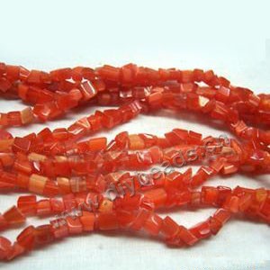 Bead, cat's eye glass, red, chip. Sold per 32-inch strand.