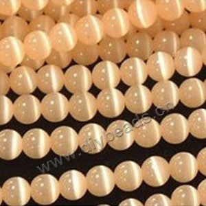 Bead, cat's eye glass,light orange, 10mm round, quality grade. Sold per 14.5-inch strand.