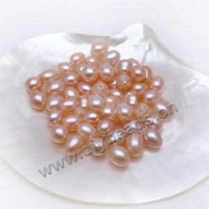Pearl, cultured freshwater , peach, 7-8mm half-drilled rice, AAA grade. Sold per pkg of 1parirs