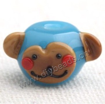 Bead,lampworked glass,blue monkey head, 23*11mm rondelle. Sold per pkg of 5.