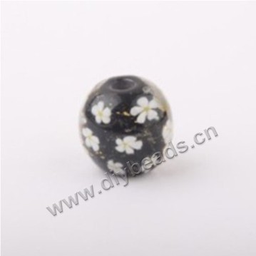 Bead, lampworked glass,black with flower, 14x14mm round.mini order 50pc 