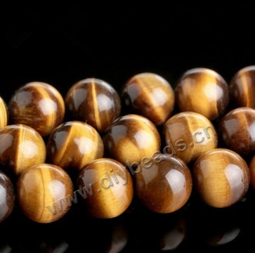 Bead, tigereye (natural), 18mm round. Sold per 16-inch strand