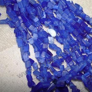 Bead, cat's eye glass, cobalt blue, chip. Sold per 32-inch strand.