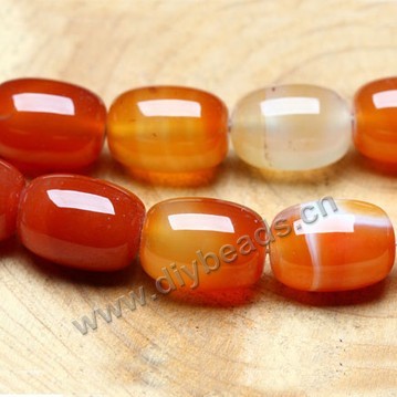 Bead,  red agate (heated), 18x13mm round tube, Mohs hardness 6-1/2 to 7. Sold per 16-inch strand.