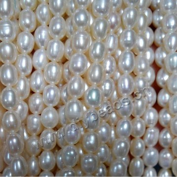 Pearl,freshwater,white color, 4-5mm rice. Sold per pkg of one strands