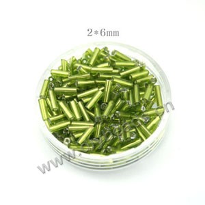 Bugle bead, glass, silver-lined lime green ,#3. Sold per pkg of 50 grams, approximately 1200ps 