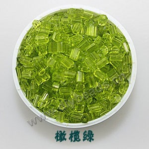 Bugle bead, glass,transparent crystal,lime green ,#1(2x2mm) beads. Sold per pkg of 80 grams,approximately 4,500ps.