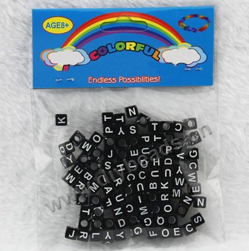 Bead, acrylic,black with white alphabet, 6x6mm cube with 4mm drill hole. Sold per pkg of 100