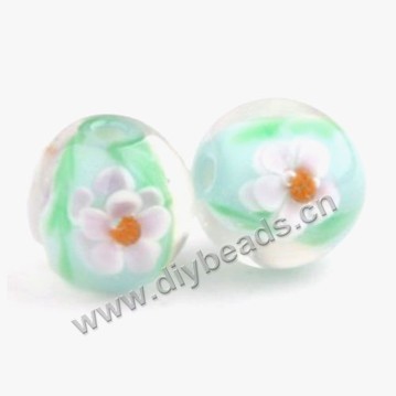 Bead, lampworked glass,green with flower, 16x16mm round.mini order 50pc 