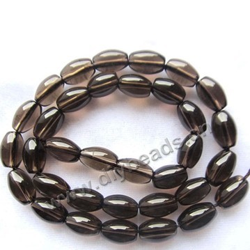 Bead, smoky quartz (heated/irradiated), 6x10mm barrel . Sold per 15-inch strand