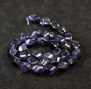 Bead, blue goldstone (manmade), 10x12mm twisted oval. Sold per 16-inch strand