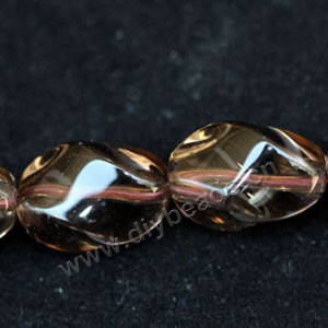 Bead, smoky quartz (heated/irradiated), 10x12mm  twisted oval A grade. Sold per 14-inch strand