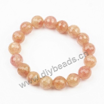 Bracelet, stretch, strawberry, red, 10mm faceted round beads, approx 19cm long. Sold per pkg of 5ps.