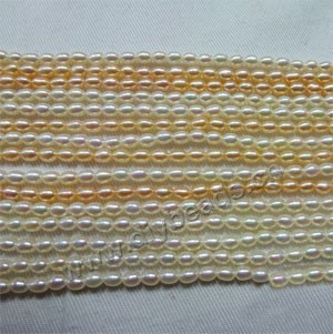 Pearl mix, cultured freshwater pearl (Natural), white / peach , 3-4mm rice,B+ grade. Sold per pkg of (10) 15-inch strands.