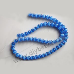 Bead, cat's eye glass,blue, 6mm round, quality grade. Sold per 14.5-inch strand.