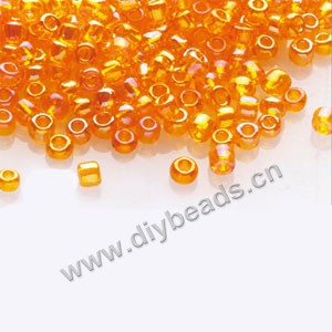 #11 seed beads,glass,orange,rainbow,irregular round.sold per pkg of 1/2 kilo.