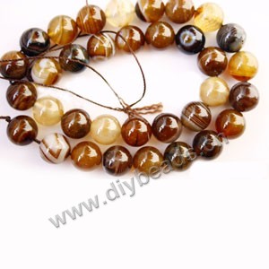 Bead, striped grey agate (dyed), 12mm round. Sold per 15-inch strand