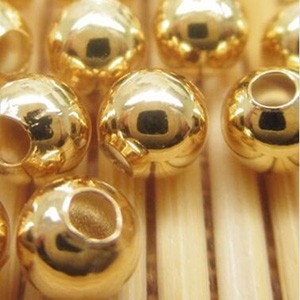 Bead,24k gold filled,5mm,round with metal, Sold per pkg of 100 pieces.