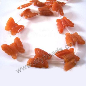Bead, red aventurine (natural), 18x21mm butterfly. Sold  approximately 15 pieces per strand