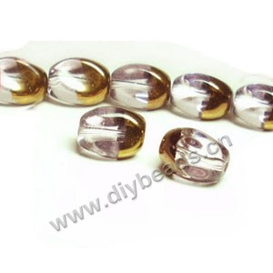 Bead ,copper-plated glass, pink, 13x10mm twisted oval. Sold per pkg of ten 30cm strand.