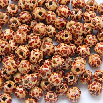 Beads,wood,round loose bead leopard swith ,10x9mm with 3mm hole. Sold per pkg of 100ps