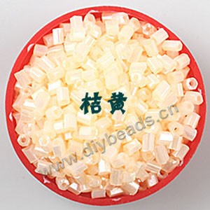 Bugle bead, glass,silky luster,tan,#1 (3x2mm)beads. Sold per pkg of 80 grams,approximately 4,500ps.