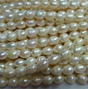 Pearl, cultured freshwater pearl (bleached), white , 6-7mm rice,D grade. Sold per pkg of (25) 15-inch strands.