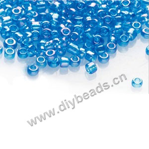  #11 seed beads,glass,turquoise blue,rainbow,irregular round.sold per pkg of 1/2 kilo.