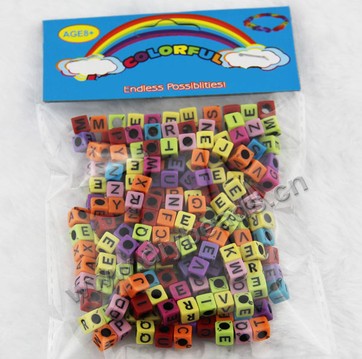 Bead, acrylic,colorful with black alphabet, 6x6mm cube . Sold per pkg of 100