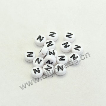Bead mix, acrylic, white with black alphabet N, 7x4mm double-sided flat round with 1.2mm drill hole. Sold per pkg of 100ps