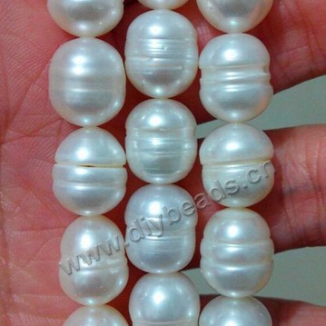 Pearl,cultured freshwater,white,10-11mm rice, AAgrade. Sold per pkg of one strand