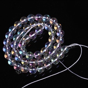 Bead,clear quartz crystal (natural),coated AB 4mm round . Sold per 16-inch strand