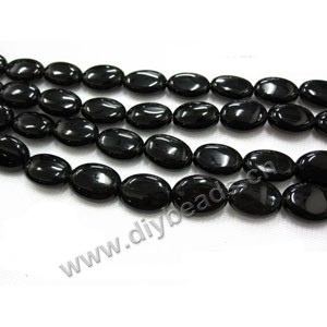 Bead, black agate (dyed), 12x10mm flat oval. Sold per 16-inch strand.