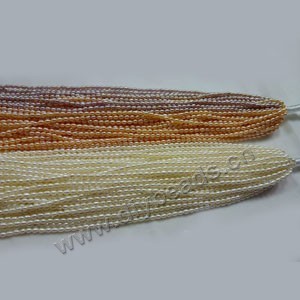 Pearl mix, cultured freshwater pearl (natural), white / peach/mauve , 3-4mm rice,B grade. Sold per pkg of (10) 15-inch strands.