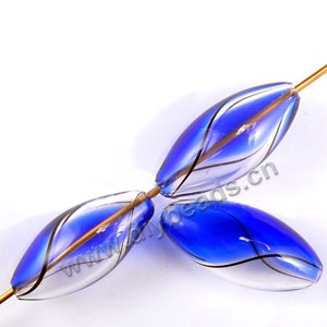 Bead, hand-blown glass, clear/cobalt blue, 25x12mm hollow oval. Sold per pkg of 10