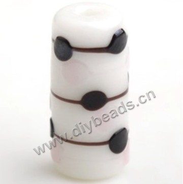 Bead,lampworked glass,white round tube with black bumpy spots. 18*9mm. Sold per pkg of 5.