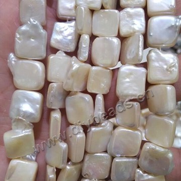Pearl,cultured freshwater,white,11-12mm square, AAA grade. Sold per pkg of one strand
