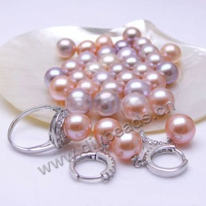 Pearl, cultured freshwater ,peach/mauve, 10-10.5mm half-drilled round, AAA grade. Sold per pkg of 1pair   