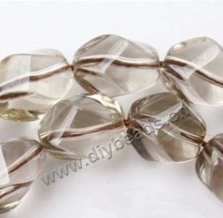 Bead, smoky quartz (heated/irradiated), 8x11mm  twisted oval A grade. Sold per 14-inch strand