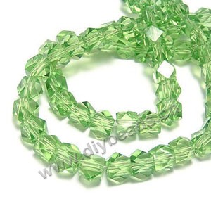 Bead, glass, spring green, 8x8mm hand-faceted cube.approximately 40ps/strand